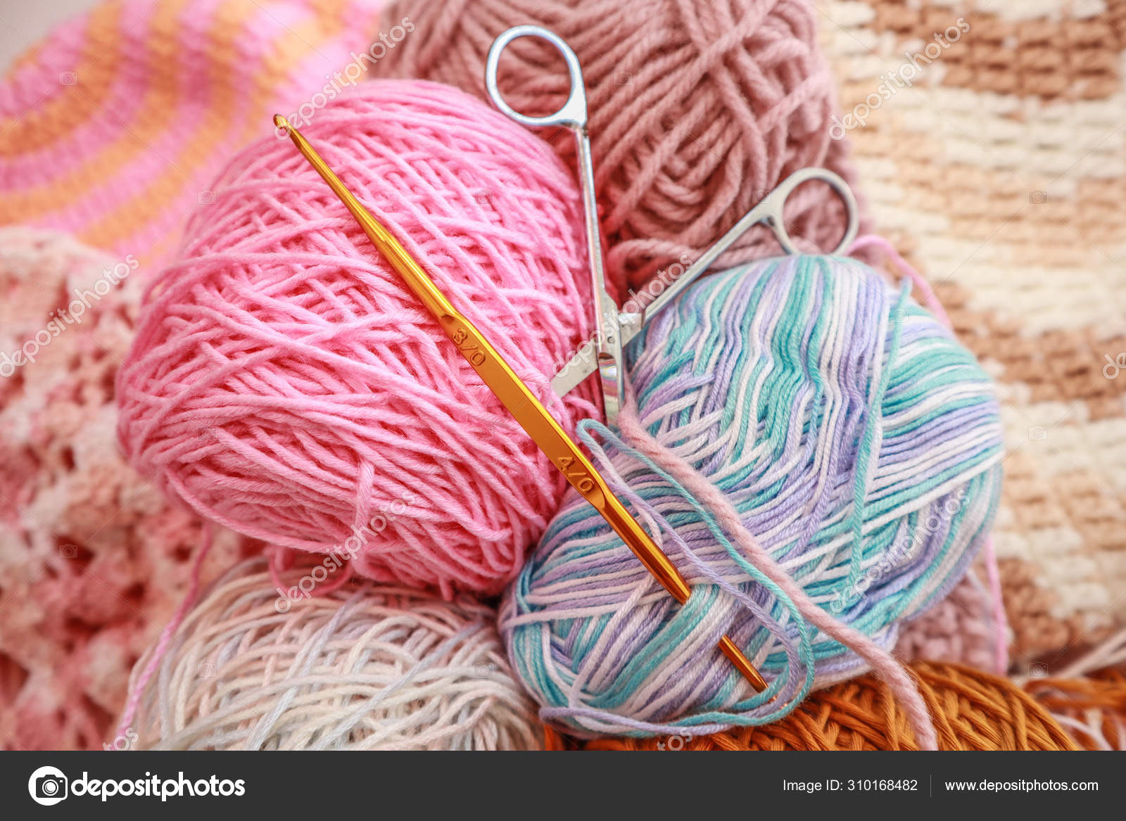 Women's hobby. Crochet and knitting. Yarns in basket with croche Stock  Photo by ©kritiya 310168482